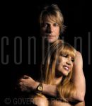 02-09-2004 Patricia Paay and Adam Curry at home in Rijkevorsel, Belgium. By order of Pulse Magazine. September 02, 2004. 

[keywords]Posed, Eyecontact, Affectionate[/keywords]